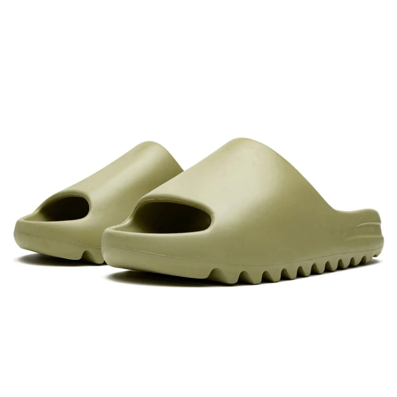 Pair of beige slides on a white background