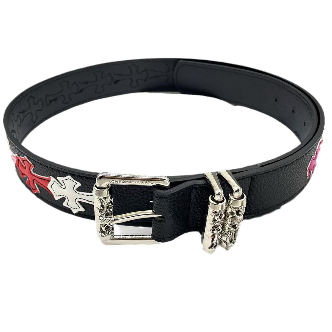 Black belt with decorative buckle on a white background