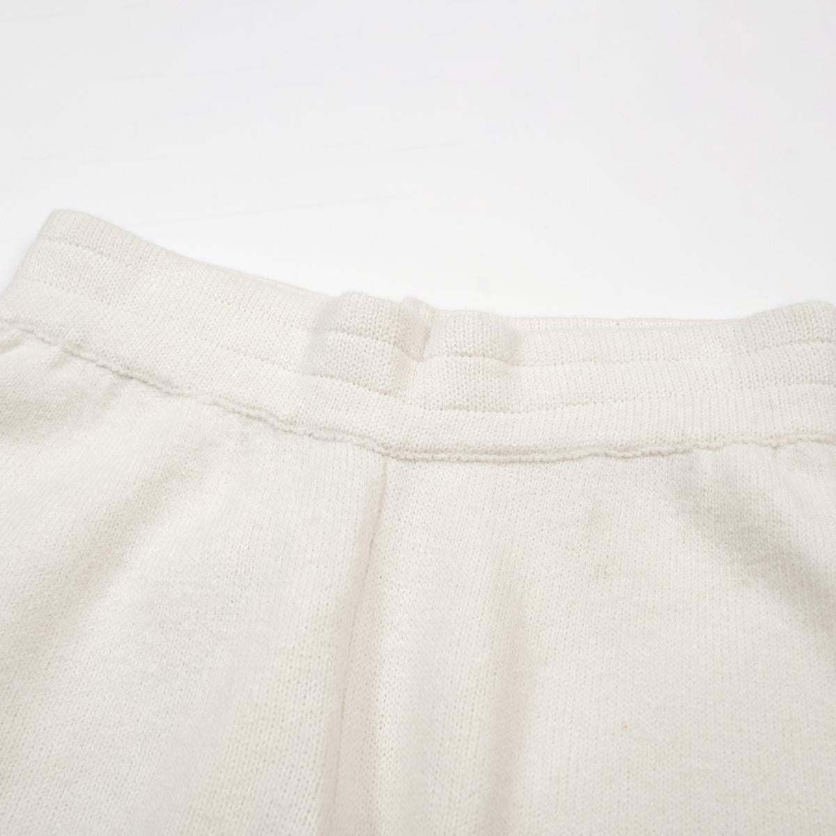 Close-up of a textured beige fabric on a white background