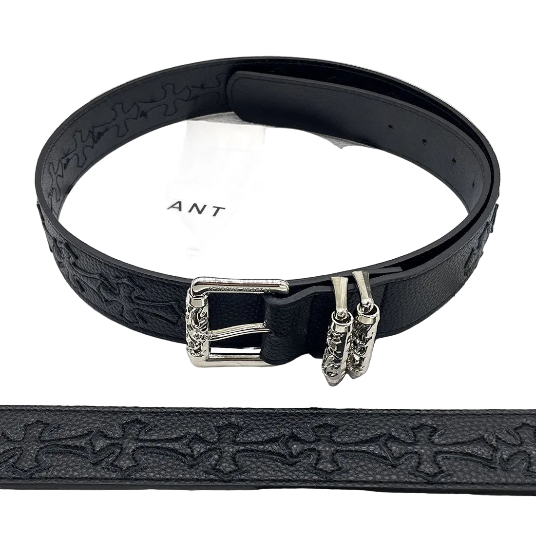 Black leather belt with silver buckle on a magazine