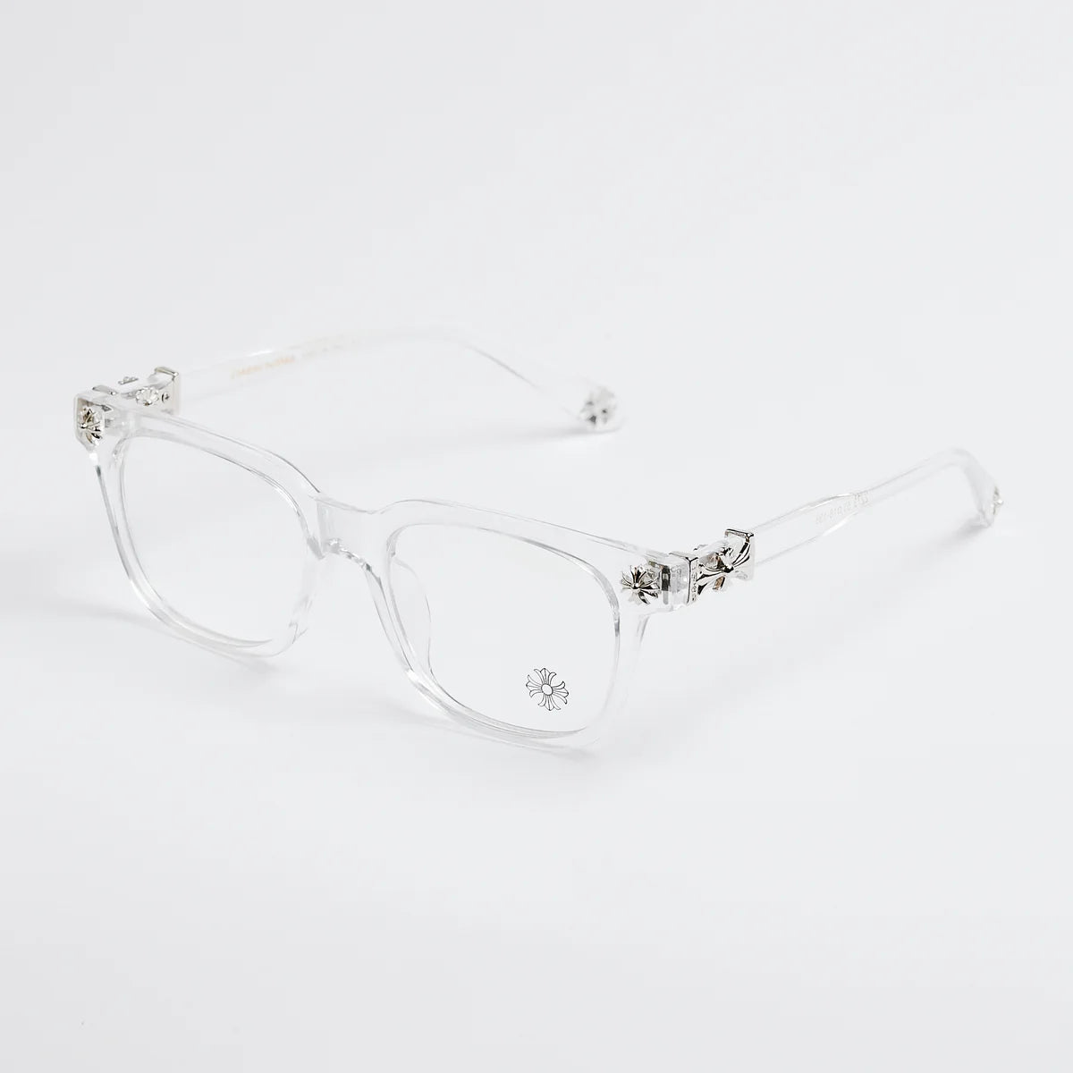 Clear eyeglasses with decorative elements on a white background