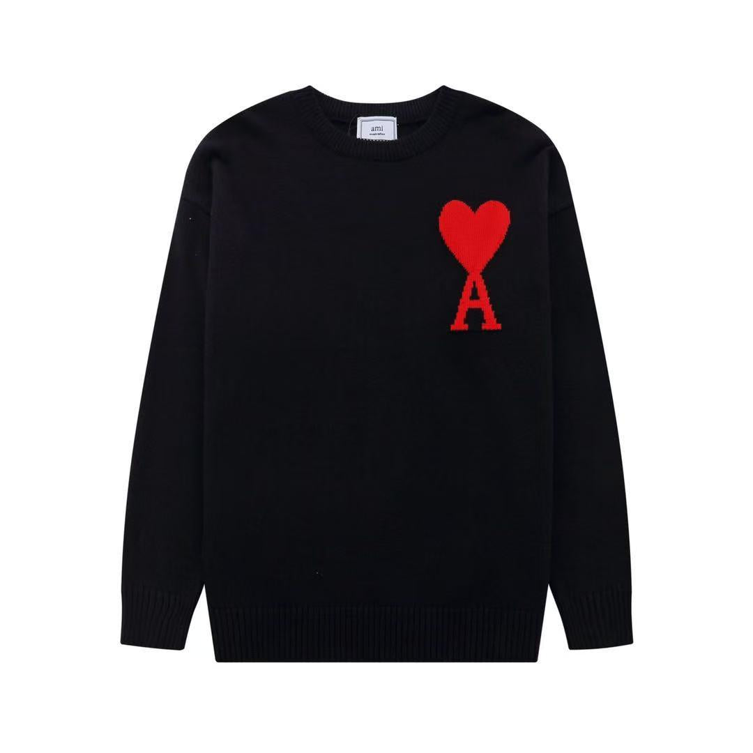 Black sweater with a red heart and letter 'A' design on a white background