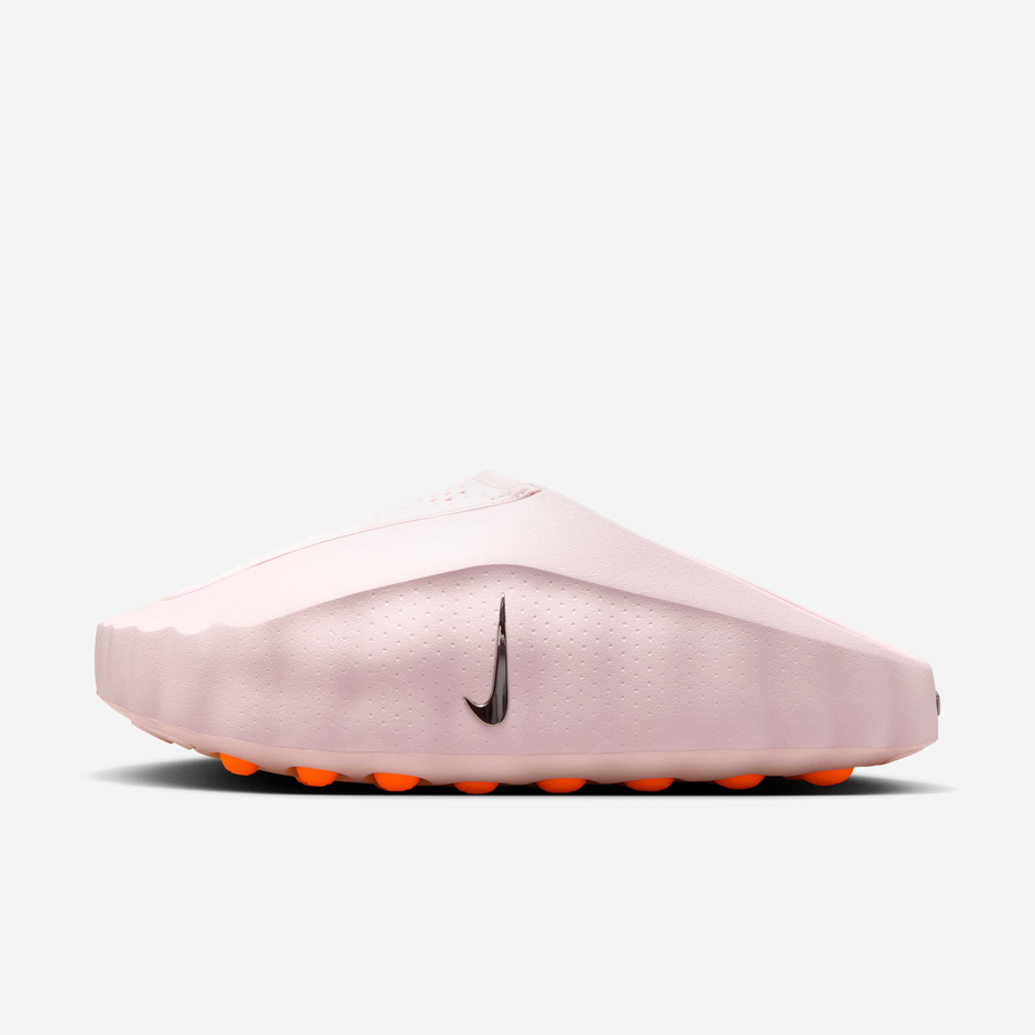 Pink golf shoe with Nike logo on a white background