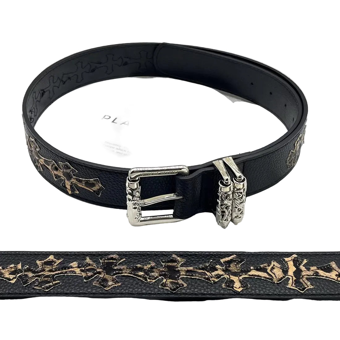 Black belt with decorative gold patterns and silver buckle on a magazine background