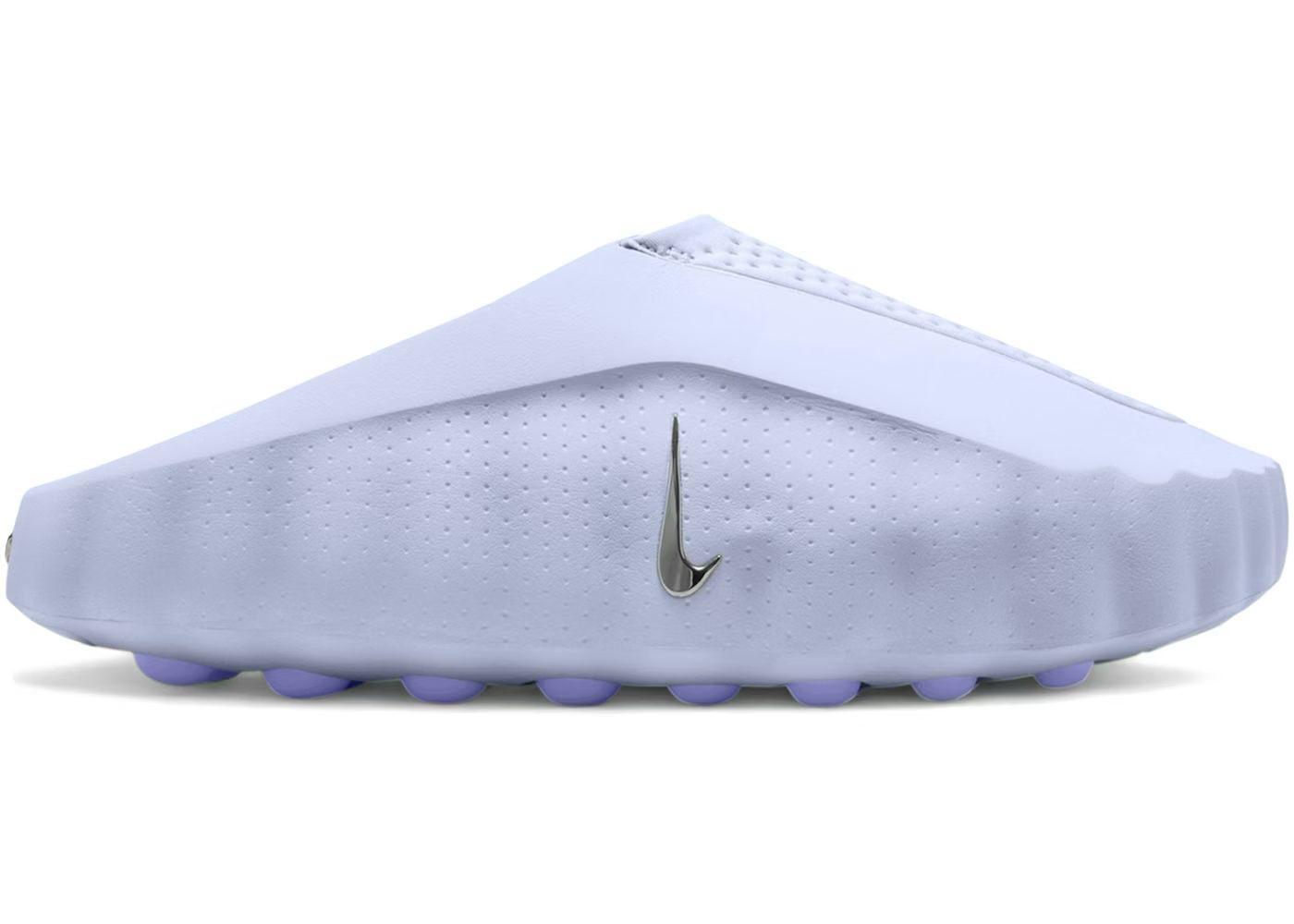 White golf shoe with purple sole on a white background