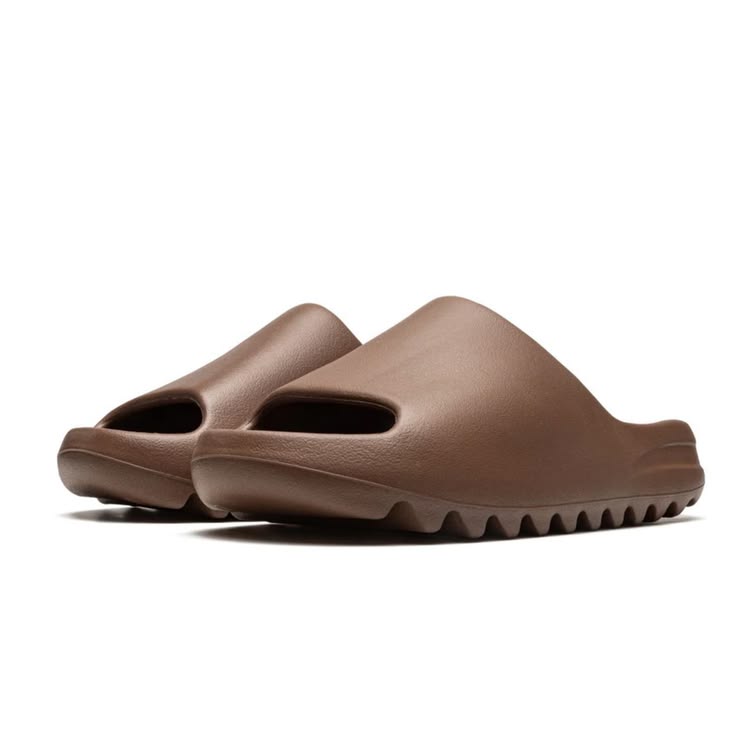 Pair of brown sandals on a white background